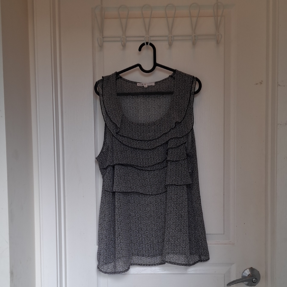 Cleo Black and Cream Ruffled Sheer Sleeveless Top.